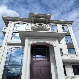 清远白麻别墅外墙干挂石材效果示例